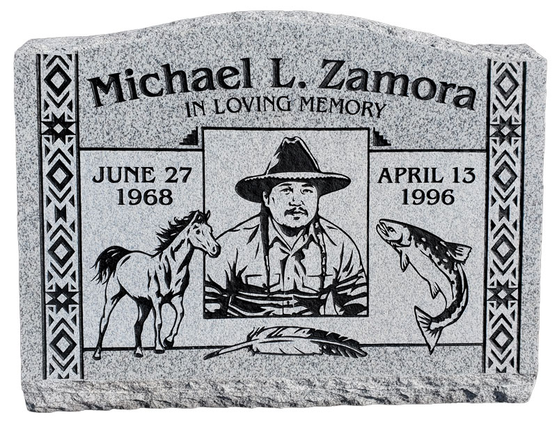 custom headstone carved with an image of the person with a Horse and fish carved on it
