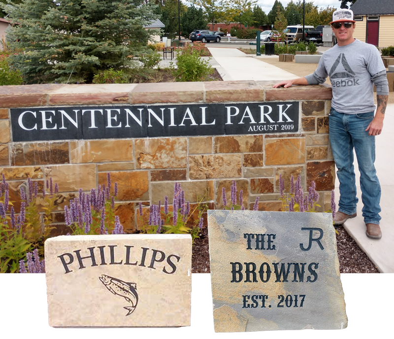 Image of a rock sign for a business and 2 family stones