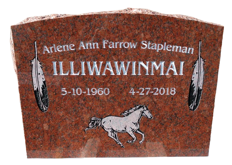 Custom red granite headstone with a running horse and feathers engraved on it